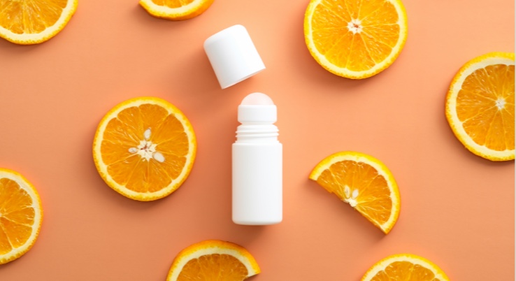Deodorant surrounded by orange peels
