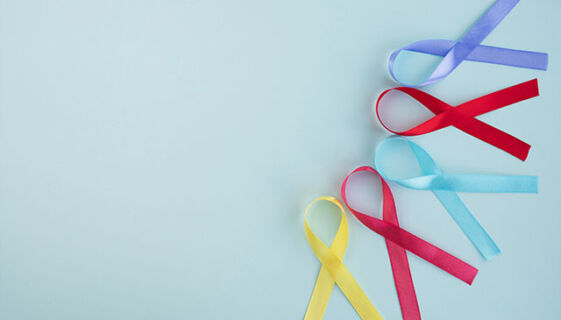 Yellow, red, blue and purple cancer awareness ribbons